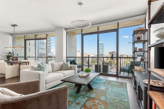 900 20th Ave S Unit 715, Nashville, TN 37212 - living room featuring a wall of windows, wood finished floors, and a city view