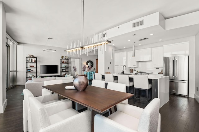 900 20th Ave S Unit 715, Nashville, TN 37212 - dining area with dark wood-style flooring, baseboards, and recessed lighting