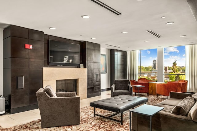 900 20th Ave S Unit 715, Nashville, TN 37212 - living area featuring a large fireplace, recessed lighting, and light tile patterned floors