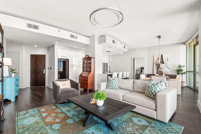 900 20th Ave S Unit 715, Nashville, TN 37212 - living room featuring dark wood-style floors and recessed lighting