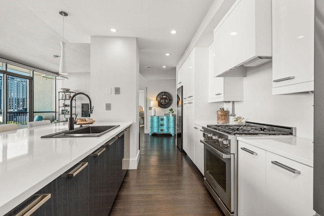 900 20th Ave S Unit 715, Nashville, TN 37212 - kitchen with high end stove, a sink, modern cabinets, light countertops, and white cabinetry