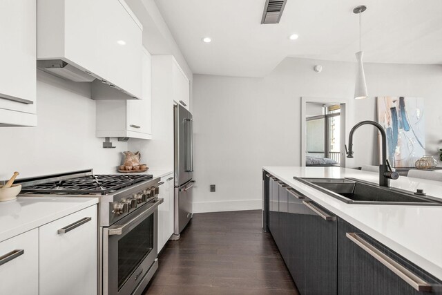 900 20th Ave S Unit 715, Nashville, TN 37212 - kitchen featuring premium appliances, a sink, light countertops, dark wood-style floors, and recessed lighting