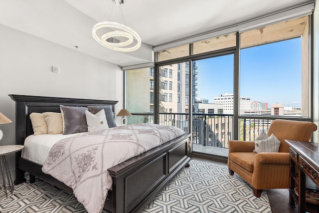 900 20th Ave S Unit 715, Nashville, TN 37212 - bedroom with access to exterior, a view of city, a chandelier, and multiple windows