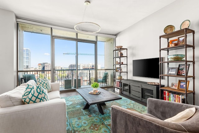 900 20th Ave S Unit 715, Nashville, TN 37212 - living area featuring floor to ceiling windows, healthy amount of natural light, a city view, and wood finished floors