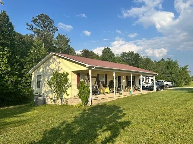 832 Fritzsche Loop, Jamestown, TN 38556 - rear view of property with a porch, a yard, and central AC unit