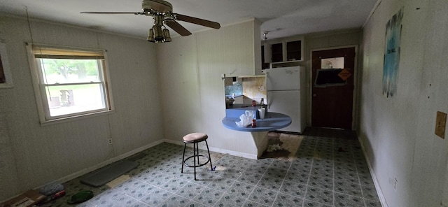 113 Brook St, Mc Ewen, TN 37101 - kitchen featuring freestanding refrigerator, tile patterned floors, ornamental molding, ceiling fan, and baseboards