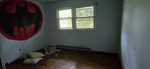 113 Brook St, Mc Ewen, TN 37101 - empty room with healthy amount of natural light, a baseboard radiator, and wood finished floors