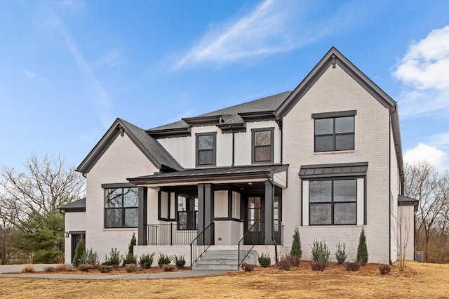 2736 Hartsville Pike, Castalian Springs, TN 37031 - view of front of home with a porch, brick siding, and board and batten siding