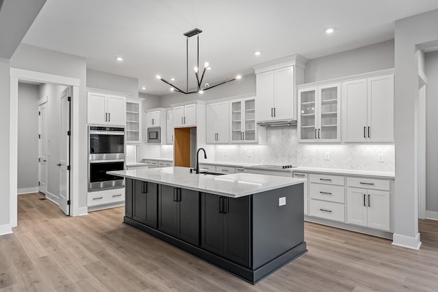 2736 Hartsville Pike, Castalian Springs, TN 37031 - kitchen featuring stainless steel appliances, white cabinets, tasteful backsplash, baseboards, and recessed lighting