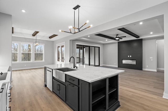 2736 Hartsville Pike, Castalian Springs, TN 37031 - kitchen featuring a sink, a chandelier, stainless steel dishwasher, ceiling fan, and light wood finished floors
