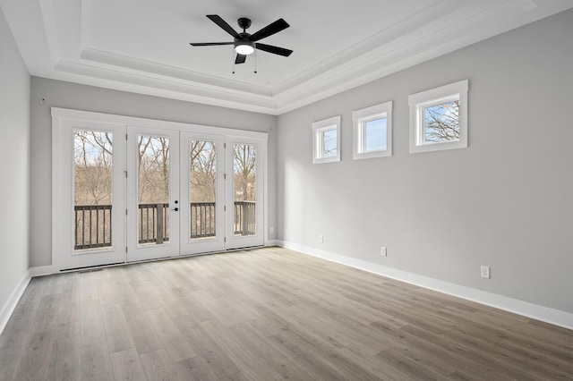2736 Hartsville Pike, Castalian Springs, TN 37031 - spare room featuring a raised ceiling, wood finished floors, ceiling fan, crown molding, and baseboards