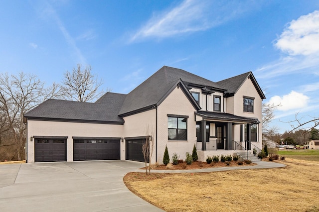 2736 Hartsville Pike, Castalian Springs, TN 37031 - view of front of house with brick siding, concrete driveway, an attached garage, a front lawn, and a porch