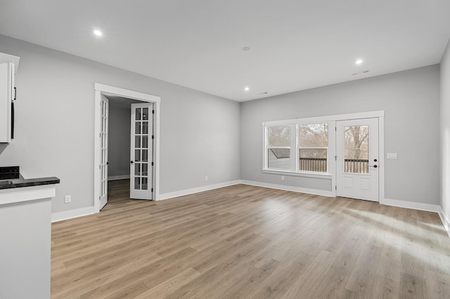 2736 Hartsville Pike, Castalian Springs, TN 37031 - unfurnished living room with light wood-style flooring, french doors, baseboards, and recessed lighting