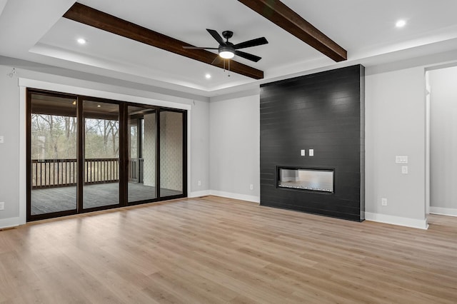 2736 Hartsville Pike, Castalian Springs, TN 37031 - unfurnished living room featuring light wood-style flooring, ceiling fan, baseboards, beamed ceiling, and recessed lighting