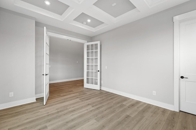 2736 Hartsville Pike, Castalian Springs, TN 37031 - unfurnished room with french doors, beamed ceiling, light wood-style floors, coffered ceiling, and baseboards