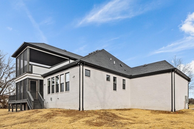 2736 Hartsville Pike, Castalian Springs, TN 37031 - view of home's exterior featuring brick siding, a sunroom, and a shingled roof