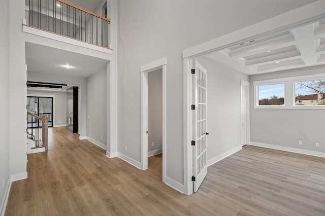 2736 Hartsville Pike, Castalian Springs, TN 37031 - hall featuring wood finished floors, baseboards, french doors, coffered ceiling, and beam ceiling