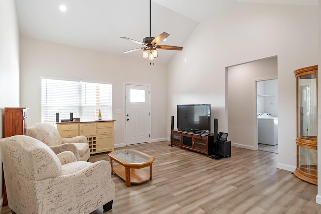 2800 N Hurricane Creek Rd, Mc Ewen, TN 37101 - living area with washer / clothes dryer, a ceiling fan, light wood finished floors, baseboards, and high vaulted ceiling