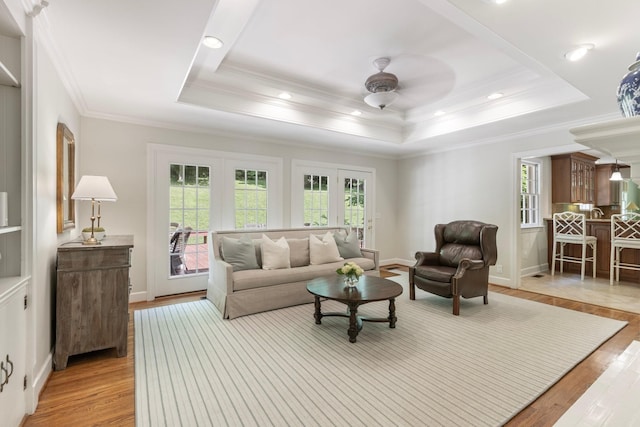 6116 Chickering Ct, Nashville, TN 37215 - living room with healthy amount of natural light, light wood-style flooring, ceiling fan, ornamental molding, and a raised ceiling