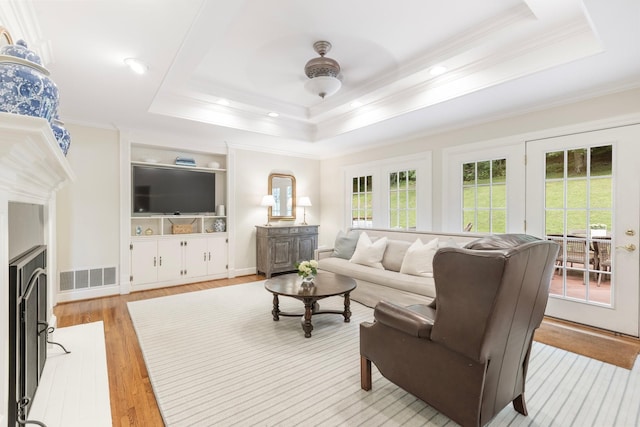 6116 Chickering Ct, Nashville, TN 37215 - living room with crown molding, a tray ceiling, light wood-style flooring, and recessed lighting