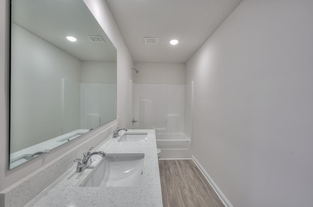 515 Cedar Brook Dr, White House, TN 37188 - bathroom with toilet, a shower, double vanity, baseboards, and wood finished floors