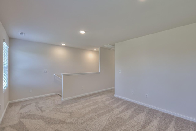 515 Cedar Brook Dr, White House, TN 37188 - spare room featuring light carpet, baseboards, and recessed lighting