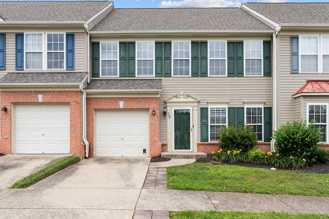 3401 Anderson Rd Unit 72, Antioch, TN 37013 - view of property with driveway, brick siding, and an attached garage