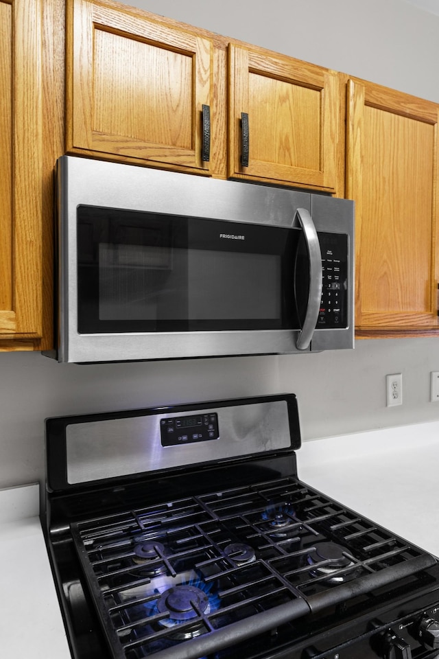 3401 Anderson Rd Unit 72, Antioch, TN 37013 - kitchen view of gas range, stainless steel microwave, and light countertops