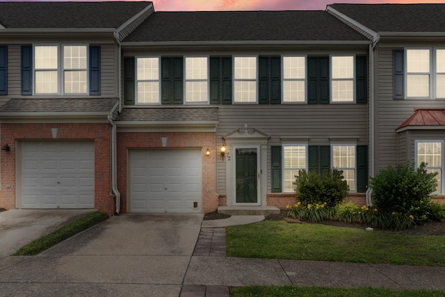 3401 Anderson Rd Unit 72, Antioch, TN 37013 - view of property with driveway, a garage, and brick siding