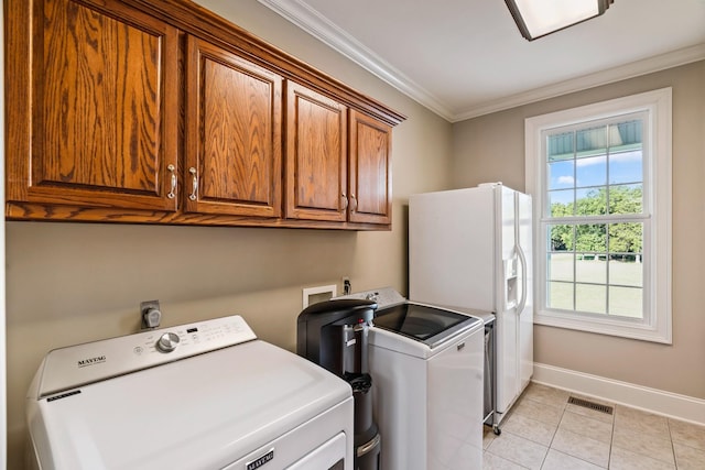 500 Old Pencil Mill Rd, Chapel Hill, TN 37034 - washroom with cabinet space, baseboards, ornamental molding, washer and dryer, and light tile patterned floors