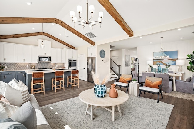 1070 Inez Dr, Smyrna, TN 37167 - living area featuring a chandelier, stairs, dark wood-style flooring, beam ceiling, and recessed lighting