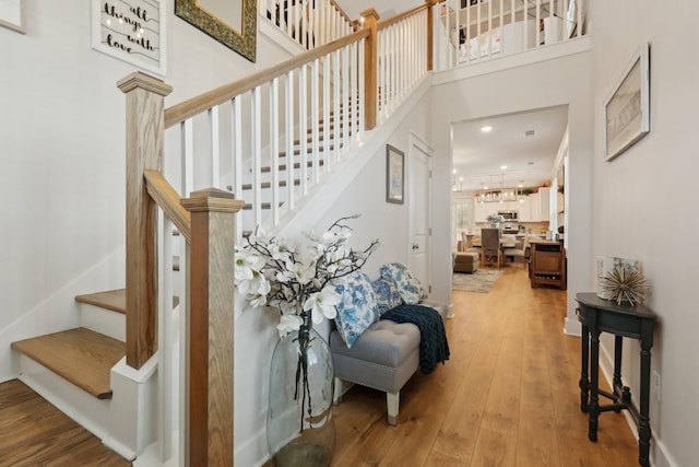 3617 Anthony Ave, Murfreesboro, TN 37129 - staircase with wood-type flooring, a high ceiling, and recessed lighting