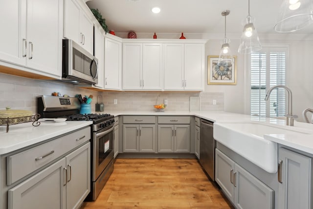 3617 Anthony Ave, Murfreesboro, TN 37129 - kitchen featuring appliances with stainless steel finishes, gray cabinetry, a sink, light countertops, and recessed lighting