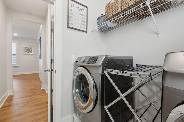 3617 Anthony Ave, Murfreesboro, TN 37129 - laundry area featuring washer / clothes dryer, light wood-style flooring, baseboards, and recessed lighting