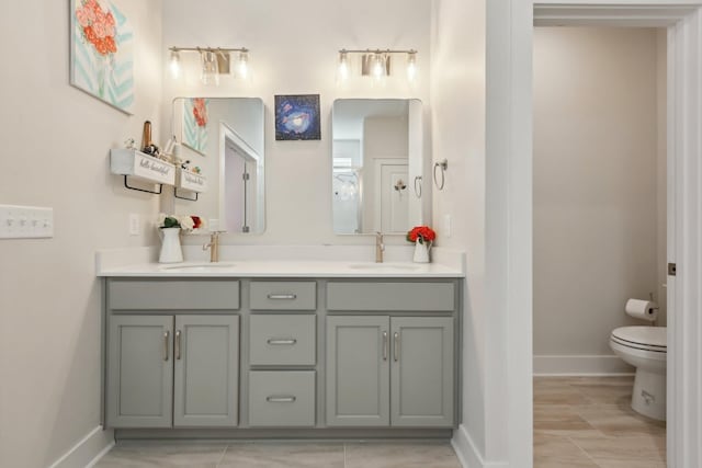 3617 Anthony Ave, Murfreesboro, TN 37129 - bathroom with toilet, double vanity, and baseboards