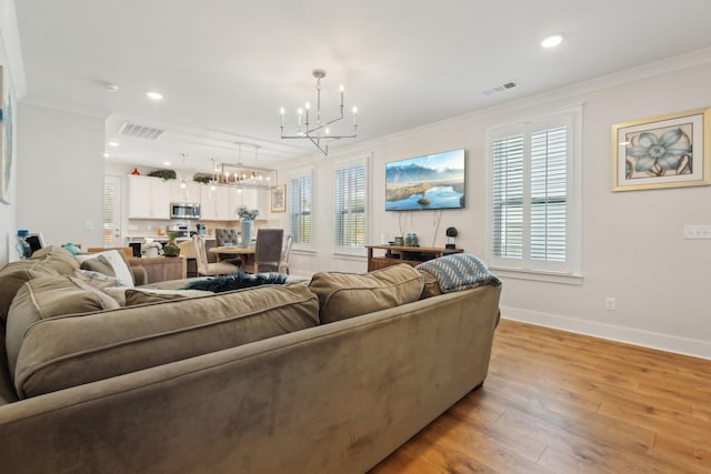 3617 Anthony Ave, Murfreesboro, TN 37129 - living area with a chandelier, crown molding, light wood-style floors, baseboards, and recessed lighting