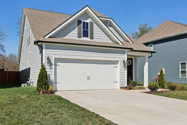 3617 Anthony Ave, Murfreesboro, TN 37129 - view of front of property featuring concrete driveway, a garage, roof with shingles, and a front lawn