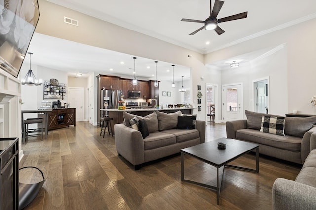121 Regency Ln, Dickson, TN 37055 - living room featuring ceiling fan, dark wood-type flooring, crown molding, a chandelier, and recessed lighting