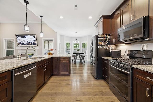 121 Regency Ln, Dickson, TN 37055 - kitchen with dishwasher, range with two ovens, a sink, freestanding refrigerator, and light wood finished floors