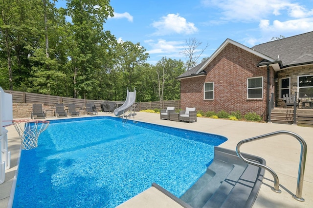 121 Regency Ln, Dickson, TN 37055 - view of pool with a water slide, outdoor lounge area, a patio area, a fenced backyard, and a deck