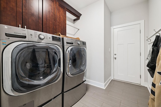 121 Regency Ln, Dickson, TN 37055 - washroom with cabinet space, washer and clothes dryer, and baseboards