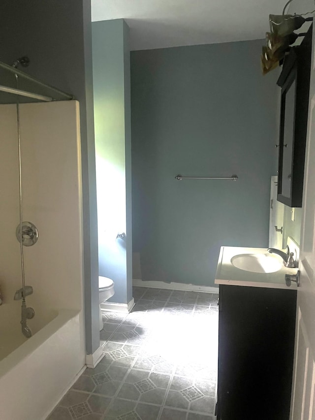 5550 Old Hickory Blvd, Hermitage, TN 37076 - full bath featuring toilet, tile patterned flooring, vanity, bathtub / shower combination, and baseboards