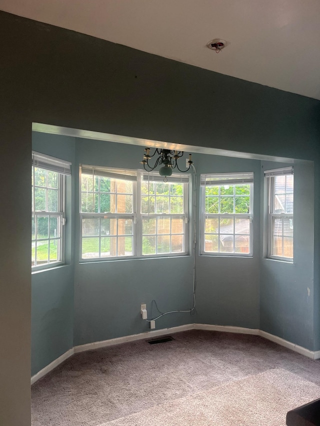 5550 Old Hickory Blvd, Hermitage, TN 37076 - unfurnished room featuring carpet floors, healthy amount of natural light, and a chandelier