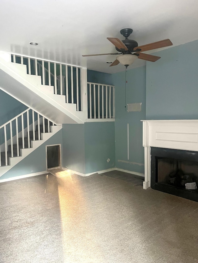 5550 Old Hickory Blvd, Hermitage, TN 37076 - unfurnished living room featuring stairs, ceiling fan, baseboards, a fireplace, and carpet