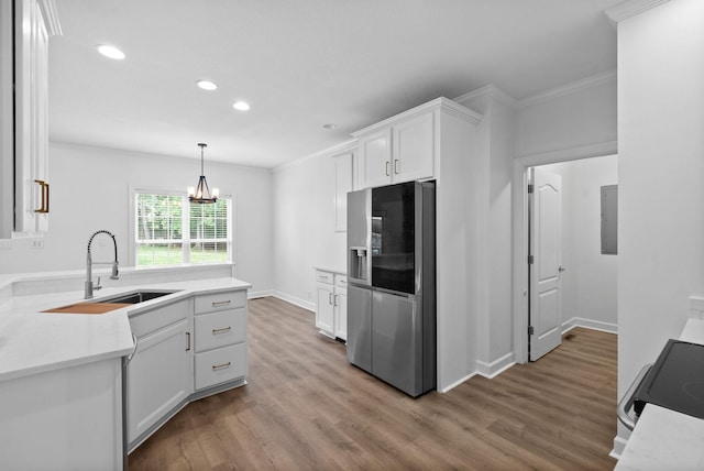 3692 Prestwicke Pl, Adams, TN 37010 - kitchen featuring stainless steel refrigerator with ice dispenser, recessed lighting, light wood finished floors, white cabinets, and light countertops