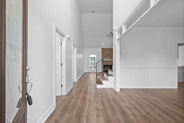 3692 Prestwicke Pl, Adams, TN 37010 - foyer entrance featuring stairway, wood finished floors, and a high ceiling