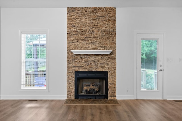 3692 Prestwicke Pl, Adams, TN 37010 - detailed view of wood finished floors and a fireplace