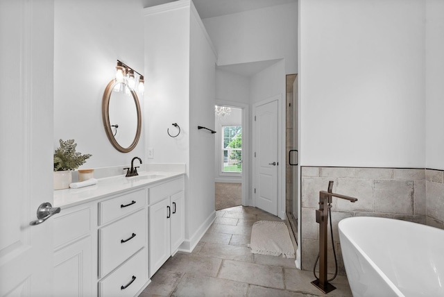 3692 Prestwicke Pl, Adams, TN 37010 - full bathroom with vanity, a soaking tub, and a stall shower