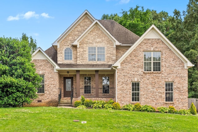 3692 Prestwicke Pl, Adams, TN 37010 - view of front facade with a front lawn, brick siding, a porch, and roof with shingles