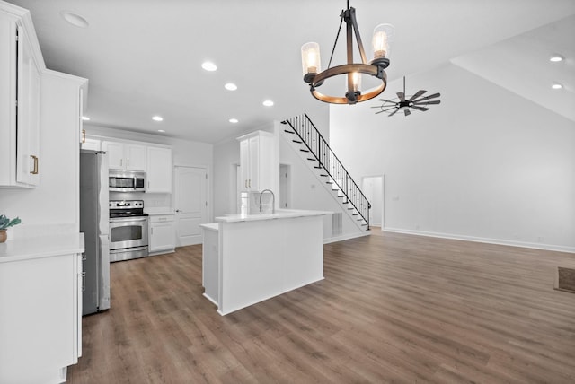 3692 Prestwicke Pl, Adams, TN 37010 - kitchen with stainless steel appliances, recessed lighting, a chandelier, white cabinets, and wood finished floors